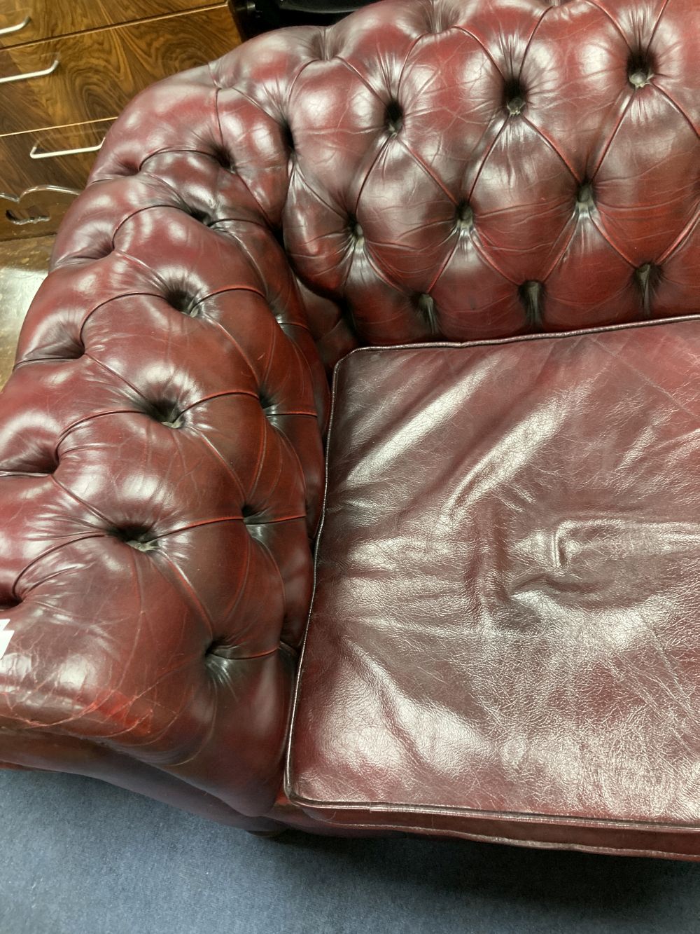 A Victorian style buttoned burgundy leather three seater Chesterfield settee, width 190cm depth 85cm height 72cm